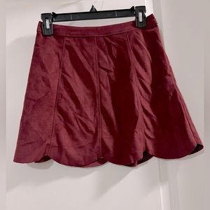 Red/maroon suede ruffle bottom mini skirt. Size small. NWT
